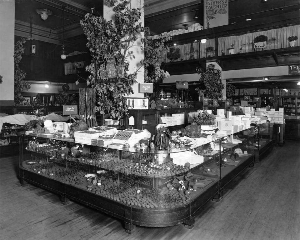 This spooky 1920s display features "Games for Halloween", "Dennison's Boogie Book", painted pumpkins, and spying owls.