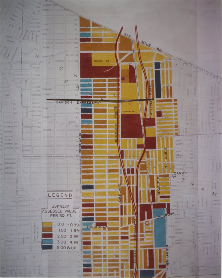 In 1956 plans were being finalized for the construction of the Chrysler Freeway (I-75) in Detroit. This photo of a map shows two proposed routes for the expressway, comparing the assessed land values south of Six Mile Road.