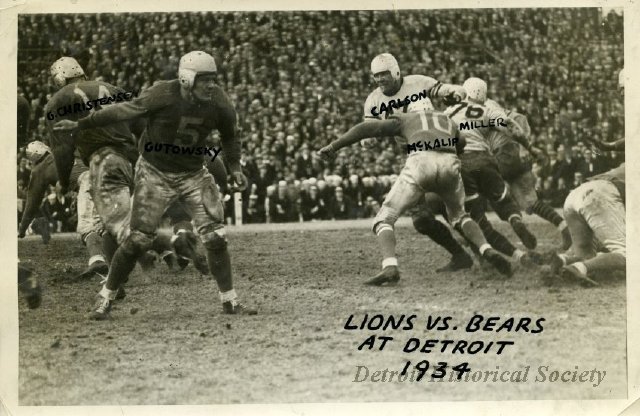 Photo depicting a play during the November 29, 1934 Lions vs. Bears game. Lions players include #14 George Christensen and #5 Ace Gutowsky.