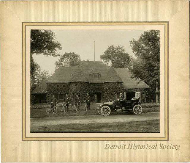 Belle Isle Police Station; four officers with bicycles and one in automobile